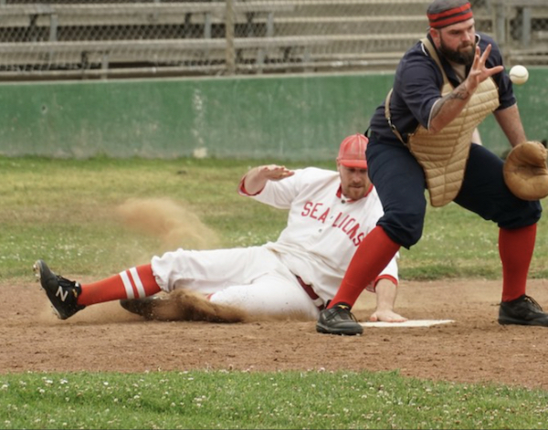 Photo of Dr. Bentley sliding to home base